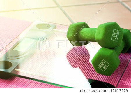 Dumbbels on fitness scales Dumbbels on fitness scales 32617379
