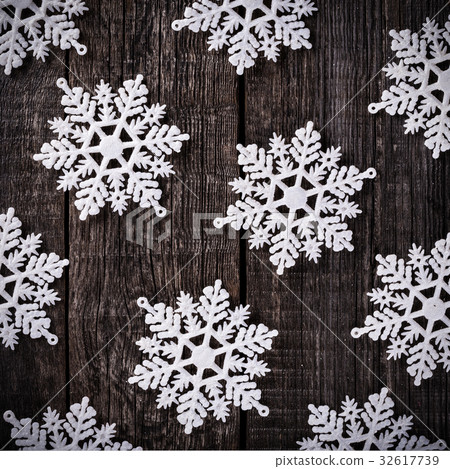 Snowflakes on wooden table Snowflakes on wooden table 32617739