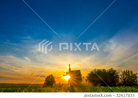 Sunrise and an Old Wooden Windmill Sunrise and an Old Wooden Windmill 32617835