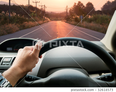 man driving car on the road man driving car on the road 32618573