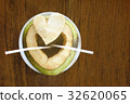 Young healthy cutted coconut with straws  32620065