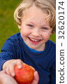 cute 5 year old child eating an apple 32620174
