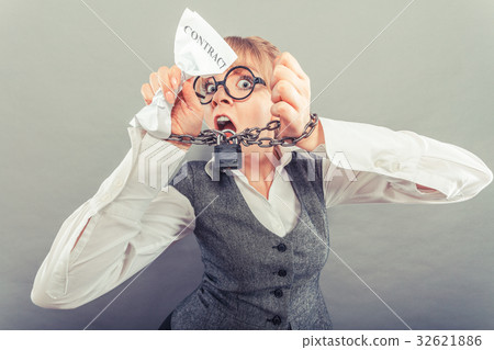 Furious woman with chained hands and contract 32621886