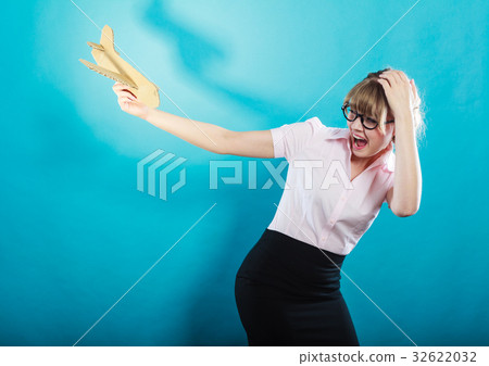 Fly fear. Woman holding airplane in hand. Fly fear. Woman holding airplane in hand. 32622032