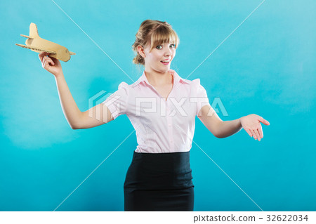woman stewardess invites to travel holds airplane 32622034