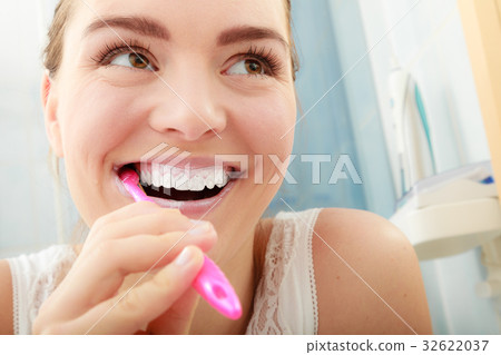 Woman brushing cleaning teeth. Oral hygiene. Woman brushing cleaning teeth. Oral hygiene. 32622037