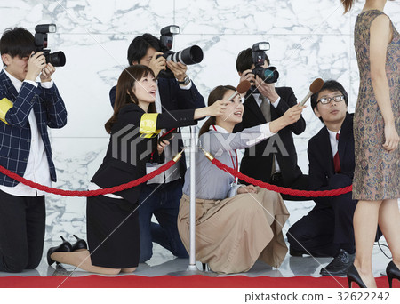 Report coverage An actress walking on a red carpet 32622242