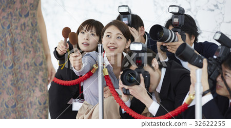 Report coverage An actress walking on a red carpet 32622255