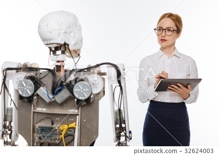 Dedicated bright woman collecting data about Dedicated bright woman collecting data about 32624003