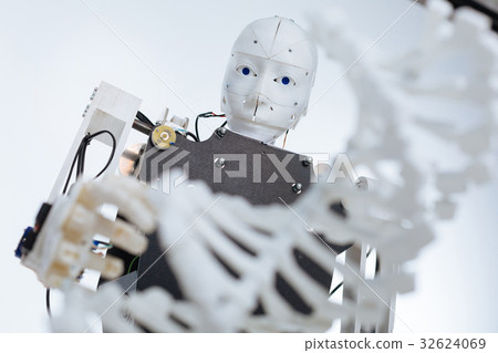 White complex robot studying the genome 32624069