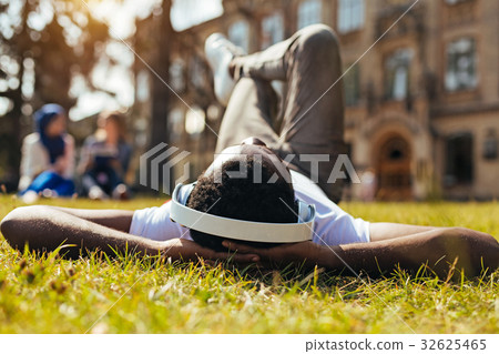 Lively optimistic man enjoying perfect playlist Lively optimistic man enjoying perfect playlist 32625465