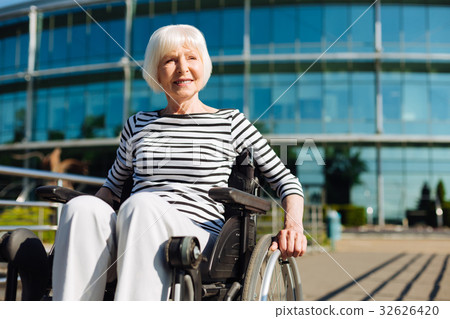 Elegant optimistic aged lady taking a sunbath Elegant optimistic aged lady taking a sunbath 32626420