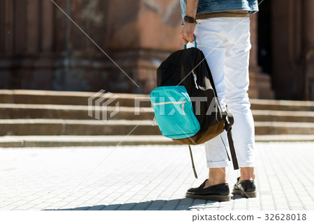 Youthful guy sightseeing around city Youthful guy sightseeing around city 32628018