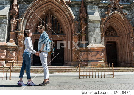 Cheerful youthful couple observing together city Cheerful youthful couple observing together city 32628425