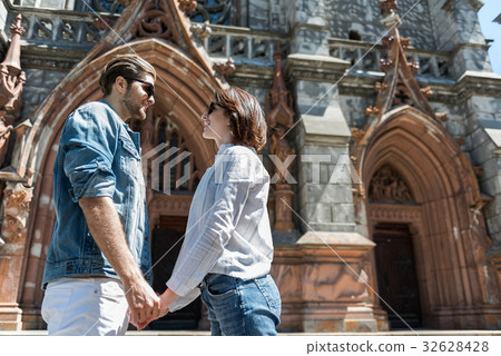 Cheerful young lady and guy enjoying visiting city Cheerful young lady and guy enjoying visiting city 32628428