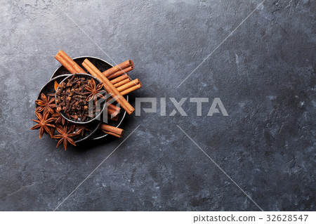 Various spices bowls over stone 32628547