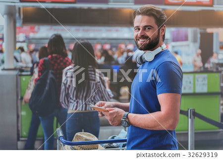 Merry smiling man in terminal Merry smiling man in terminal 32629319