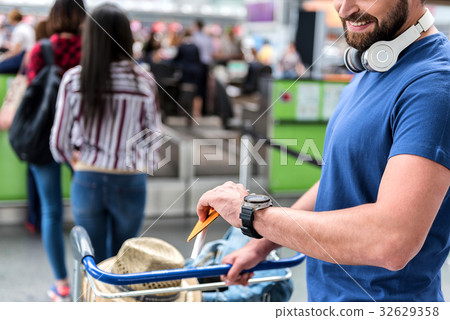 Happy smiling man checking time 32629358