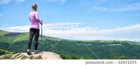 Young woman hiking in the mountains 32631035