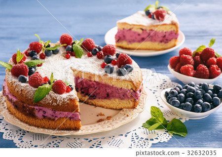 Delicious homemade cake with berry cheese cream. 32632035