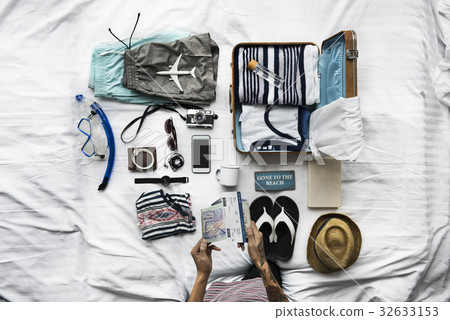 Hands with tattoo checking passport and ticket Hands with tattoo checking passport and ticket 32633153