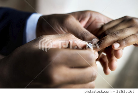 Groom Put on Wedding Ring Bride Hand Groom Put on Wedding Ring Bride Hand 32633165