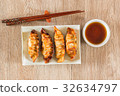 plate of Japanese gyoza, dumplings  with soy sauce 32634797