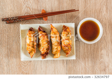 plate of Japanese gyoza, dumplings  with soy sauce 32634797