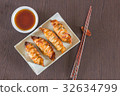 plate of Japanese gyoza, dumplings  with soy sauce 32634799