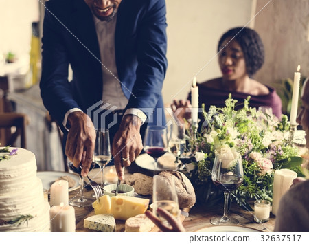 Hands Holding Knife and Fork Getting Food From Dish Hands Holding Knife and Fork Getting Food From Dish 32637517