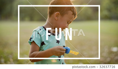 Young boy playing with soap bubble at the park 32637716