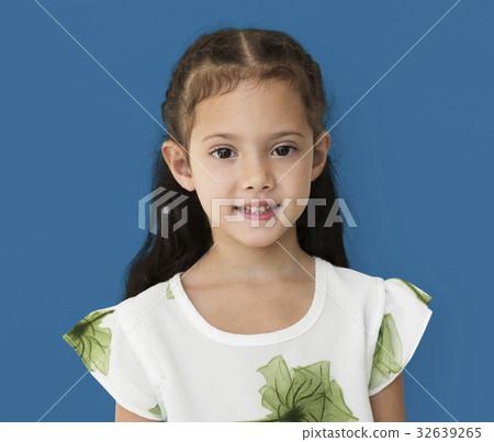 Young little girl with awkward smile expression portrait 32639265