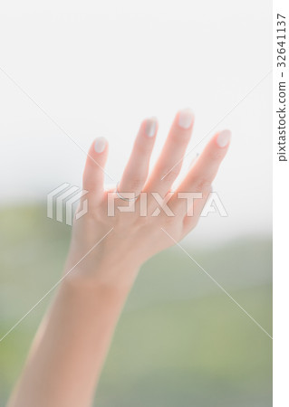 outside, hold one's hands out, shade one's eye 32641137