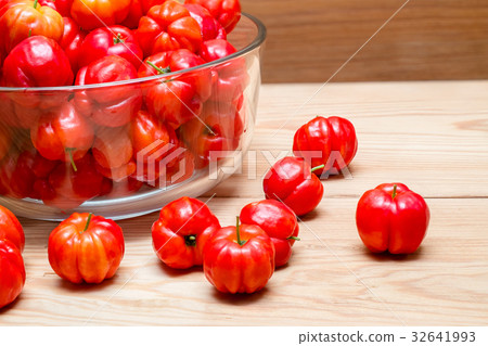 fresh cherries in a glass bowl on wood table fresh cherries in a glass bowl on wood table 32641993