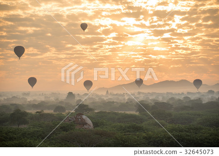 Hot air balloon over ancient pagoda in Bagan 32645073