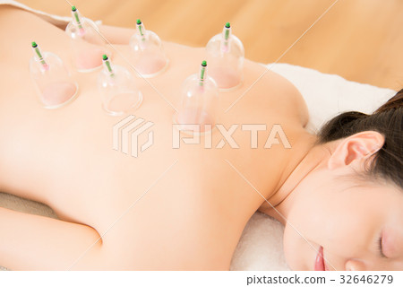 lying on chest with cupping treatment 32646279