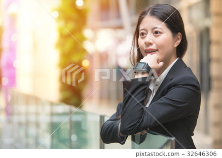 business woman wearing smartwatch on her wrist 32646306