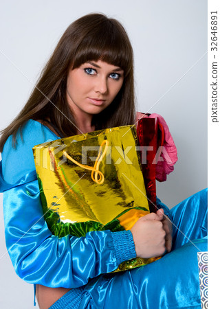 The attractive girl with two packages The attractive girl with two packages 32646891