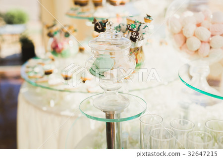 Delicious sweets on wedding candy buffet with Delicious sweets on wedding candy buffet with 32647215