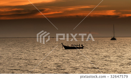 Fisherman boat silhouette on sunset time. 32647579