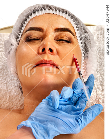 Filler injection female face. Plastic facial Filler injection female face. Plastic facial 32647944