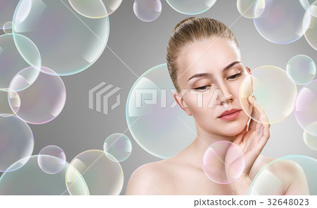 Beautiful sensual woman in soap bubbles. 32648023