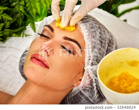 Facial mask from fruits for woman. Girl in medical 32648024