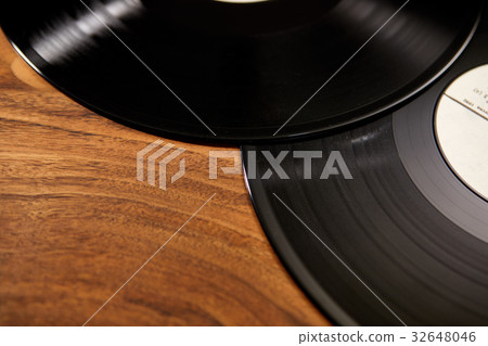 Vinyl records on wooden table 32648046