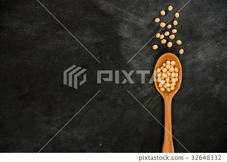 raw uncooked soybeans put on wood texture spoon raw uncooked soybeans put on wood texture spoon 32648332