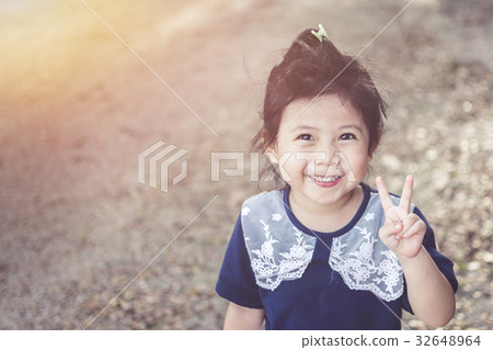 Cute Asian baby Smiling in garden. 32648964