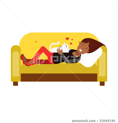 Young woman lying on an yellow sofa and embracing Young woman lying on an yellow sofa and embracing 32649140