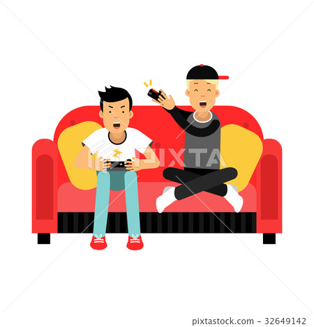 Two young male friend sitting on sofa and playing 32649142