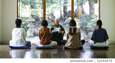 A woman listening to something 32649574