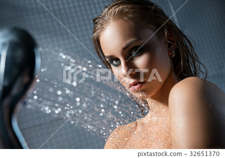 Gorgeous blonde topless having shower portrait 32651370
